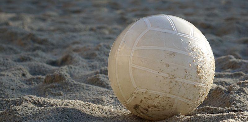 Beach volleyball on sand.